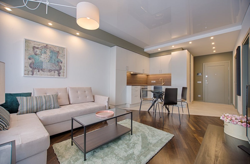 Minimal residence with stone tones and soft furniture